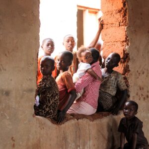 children sitting on window